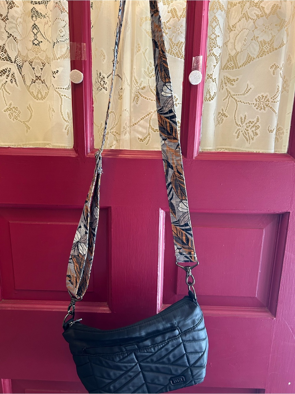 lug Black Quilted Crossbody Bag with Floral Accent Strap